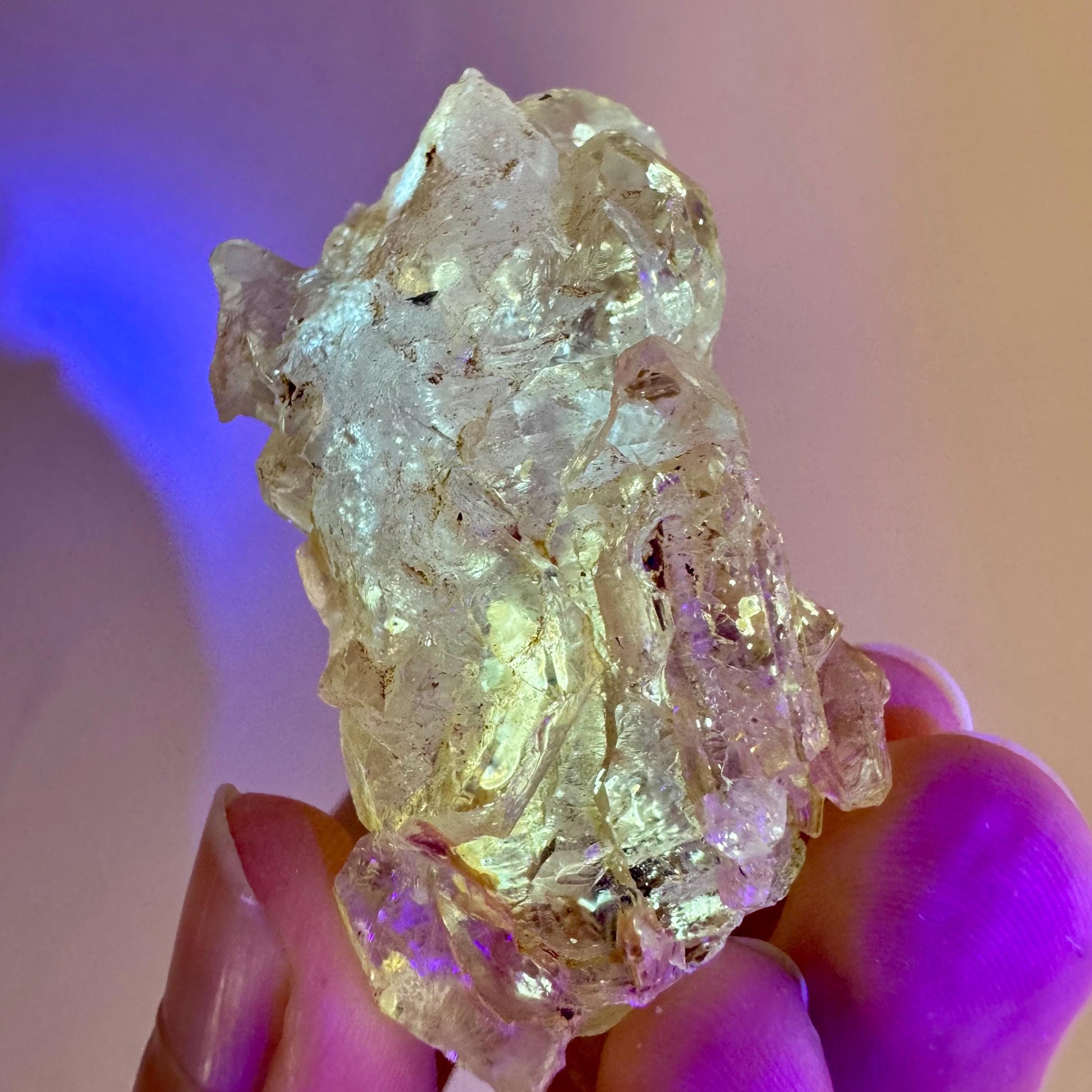 Firefly Petroleum Quartz | UV reactive crystal, fluorescent mineral from Madagascar