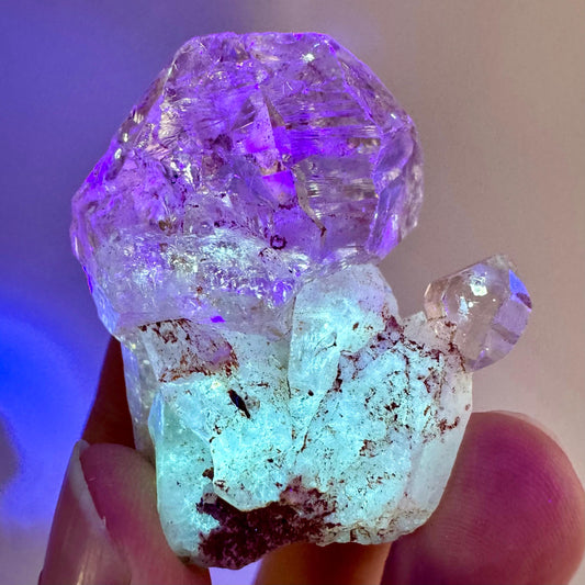 Firefly Petroleum Quartz | UV reactive crystal, fluorescent mineral from Madagascar