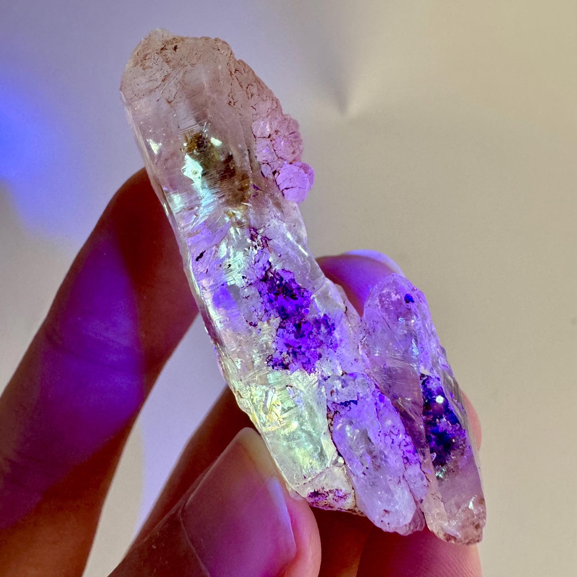 Firefly Petroleum Quartz | UV reactive crystal, fluorescent mineral from Madagascar