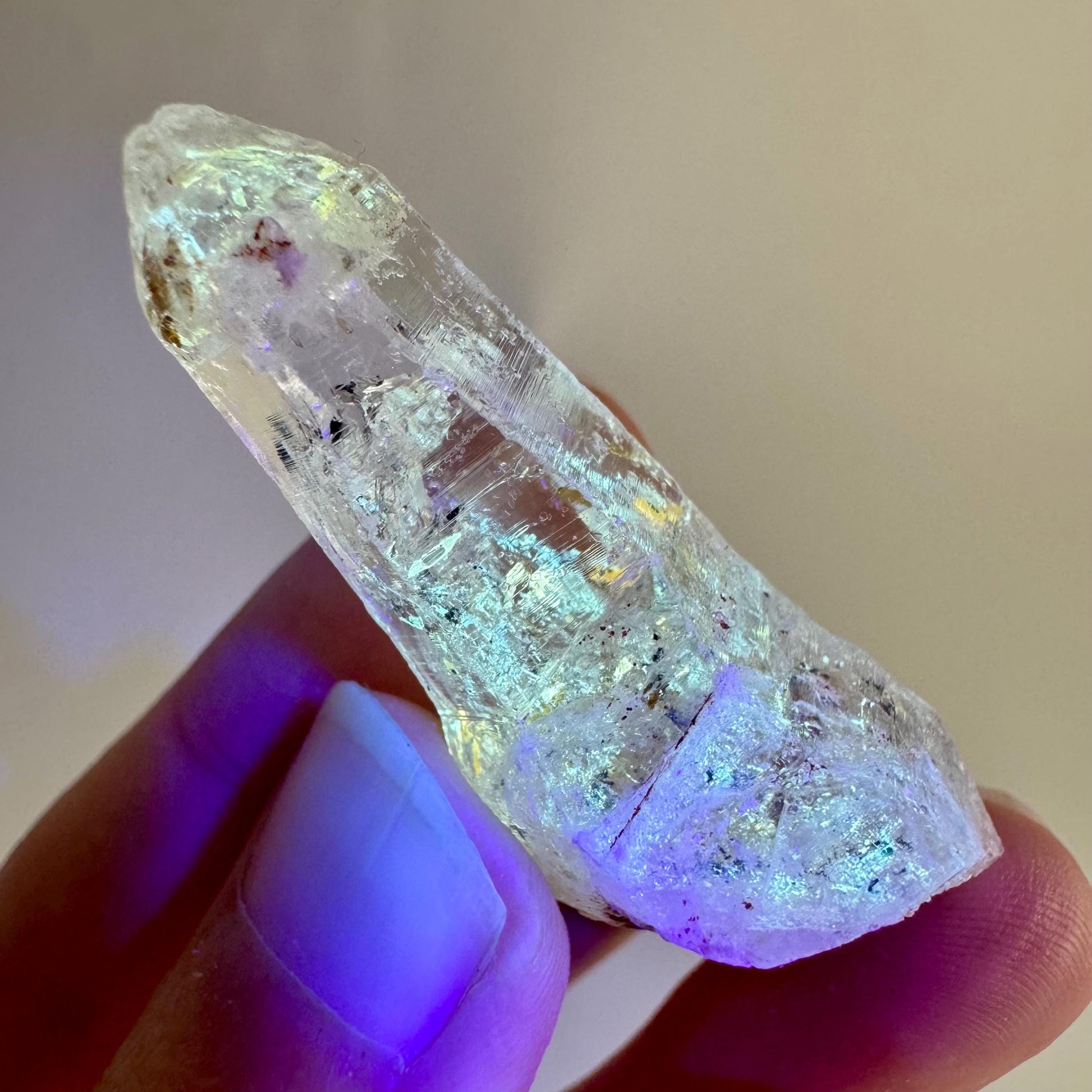 Firefly Petroleum Quartz | UV reactive crystal, fluorescent mineral from Madagascar