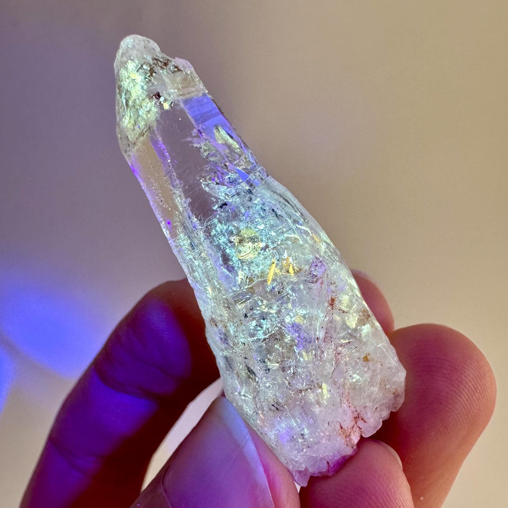 Firefly Petroleum Quartz | UV reactive crystal, fluorescent mineral from Madagascar