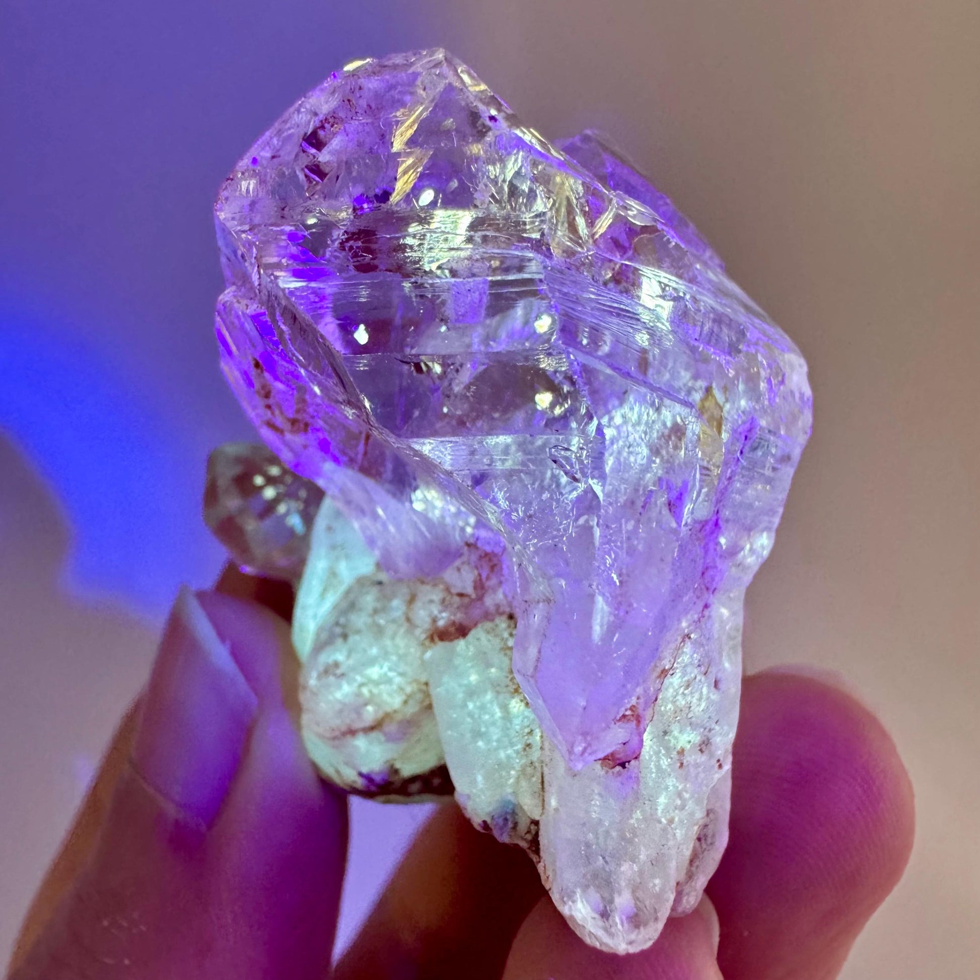 Firefly Petroleum Quartz | UV reactive crystal, fluorescent mineral from Madagascar