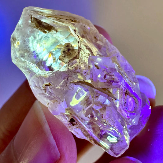 Firefly Petroleum Quartz | UV reactive crystal, fluorescent mineral from Madagascar