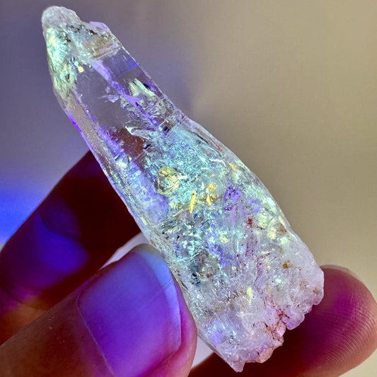 Firefly Petroleum Quartz | UV reactive crystal, fluorescent mineral from Madagascar